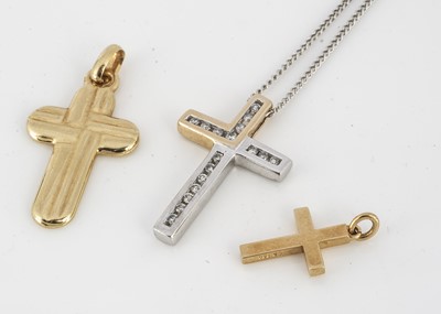 Lot 239 - An 18ct two colour gold diamond set cross pendant