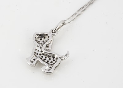 Lot 246 - A 9ct gold and diamond encrusted puppy pendant