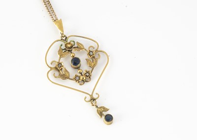 Lot 296 - A 9ct gold Edwardian sapphire and seed pearl openwork floral pendant
