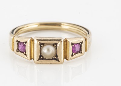 Lot 31 - An Art Deco ruby and pearl three stone dress ring