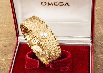 Lot 404 - A c1960s Omega 18ct gold lady's cocktail dress wristwatch