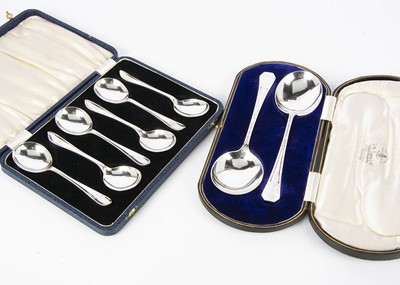 Lot 464 - A cased pair of George V silver dessert servers by Henry Wilkinson