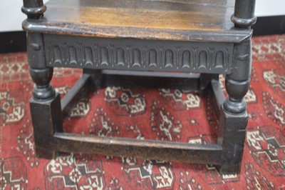 Lot 24 - A 17th  Century English oak wainscot armchair