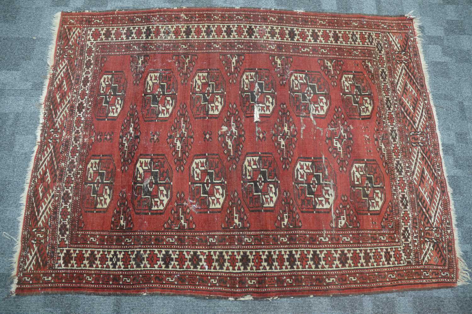 Lot 52 - An antique red ground Bokhara wool rug