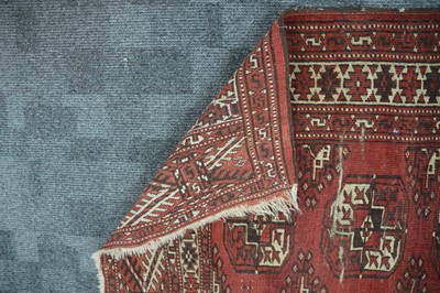 Lot 52 - An antique red ground Bokhara wool rug