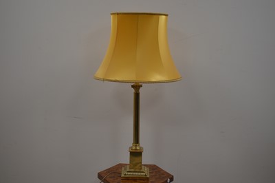 Lot 414 - A tall Corinthian column shaped brass table lamp