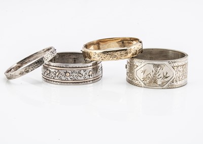 Lot 60 - A collection of silver bangles