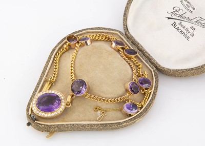 Lot 342 - An Edwardian 15ct marked amethyst and seed pearl necklace and pendant