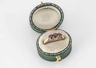 Lot 330 - A three stone diamond dress ring