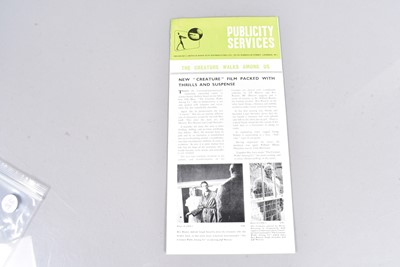 Lot 358 - The Creature Walks Among Us Pressbook / Campaign Book