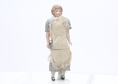 Lot 369 - A German bisque shoulder-head housekeeper dolls' house doll