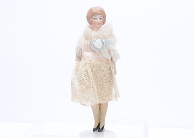 Lot 370 - An Edwardian bisque shoulder-head dolls' house lady doll