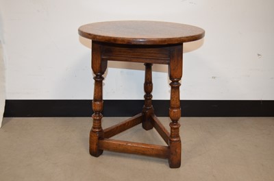 Lot 48 - A reproduction 18th century style oak cricket table by Tichmarsh & Goodwin of Ipswich.