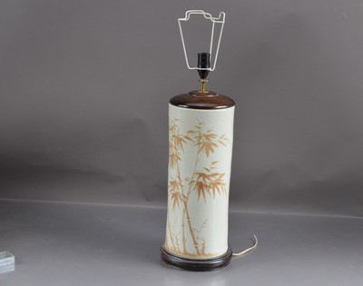 Lot 403 - A tall ceramic and turned wood table lamp