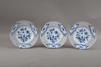 Lot 63 - Three turn of the century Meissen porcelain reticulated plates, blue and white foliate design with gilt edges, printed marks and partially impressed numbers to the undersides, all 20.5cm diameter (3)