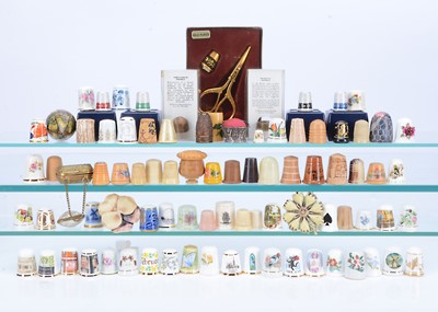 Lot 428 - A collection of various thimbles and sewing related items