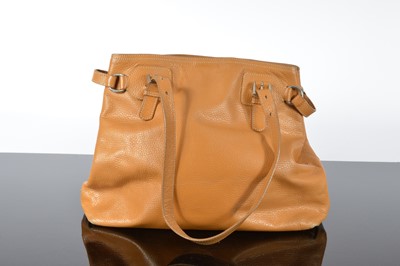 Lot 119 - A Prada brown leather handbag