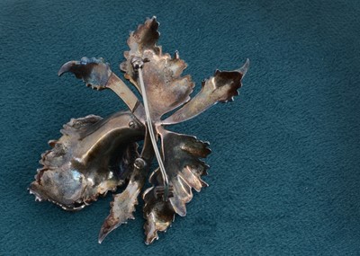 Lot 3 - A large silver enamel and marcasite floral brooch