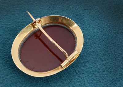 Lot 14 - A mid 19th century hard stone sard onyx cameo brooch