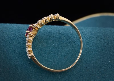 Lot 22 - A continental 750 marked ruby and cubic zirconia wishbone ring