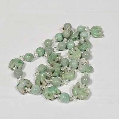 Lot 55 - A string of jadeite jade and boneite beads