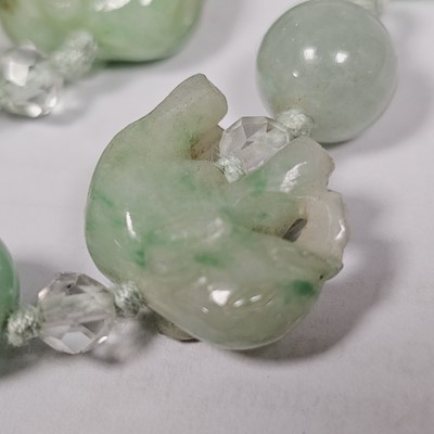 Lot 55 - A string of jadeite jade and boneite beads