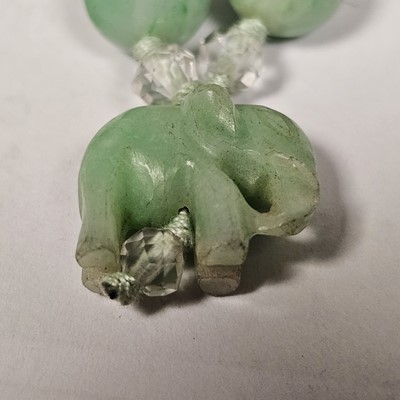 Lot 55 - A string of jadeite jade and boneite beads