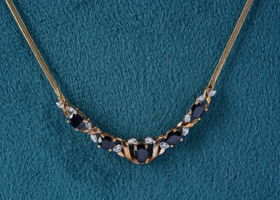 Lot 64 - A 9ct gold sapphire and diamond necklace and pendant