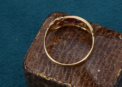 Lot 79 - An Edwardian five stone diamond and ruby dress ring