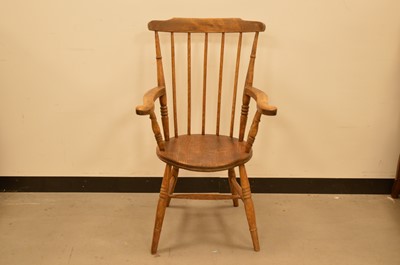 Lot 419 - A 19th century elm stick back armchair