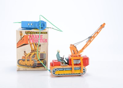 Lot 407 - A Swallow Toys (Japan) Tinplate Battery-Operated Remote Control Crane Tractor