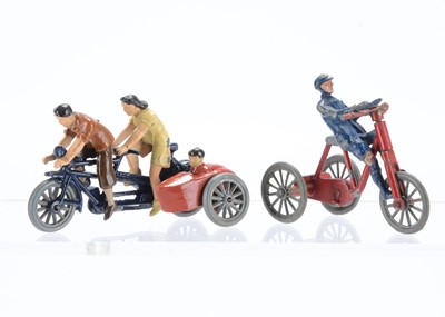 Lot 607 - Morestone Boy riding tricycle and couple on tandem with child in sidecar