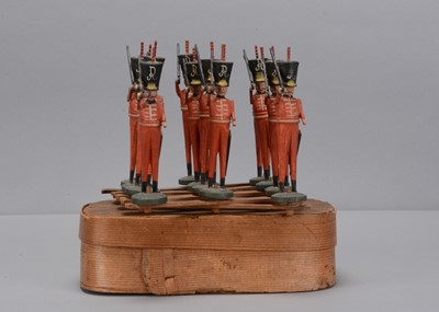 Lot 71 - An 1820s Seiffen/Olberhau region turned wooden scissor toy of Hussar soldiers