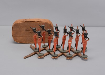 Lot 71 - An 1820s Seiffen/Olberhau region turned wooden scissor toy of Hussar soldiers
