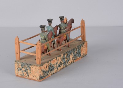 Lot 77 - A mid 19th century Erzgebirge cavalry crank toy