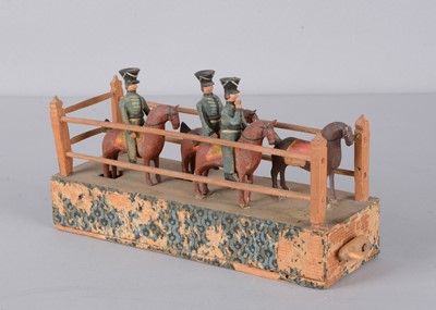 Lot 77 - A mid 19th century Erzgebirge cavalry crank toy