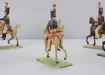 Lot 90 - Eight late 19th century German composition and wood French Napoleonic Cavalry