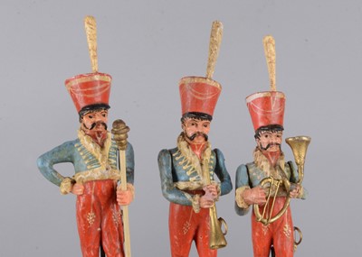 Lot 105 - Four mid 19th century wooden Hussar bandsmen