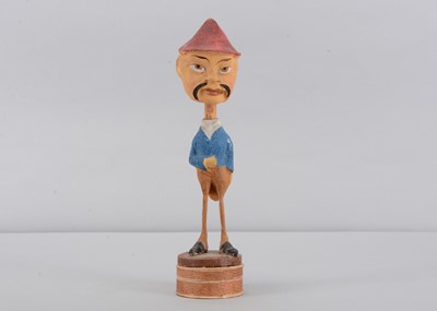 Lot 142 - An early 20th century German composition comic chinaman nodder candy or sweet container