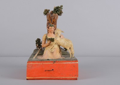 Lot 174 - An 1830s Sonneberg papier-mâché and wood hand-cranked mechanical toy of a shepherdess