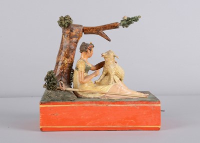 Lot 174 - An 1830s Sonneberg papier-mâché and wood hand-cranked mechanical toy of a shepherdess