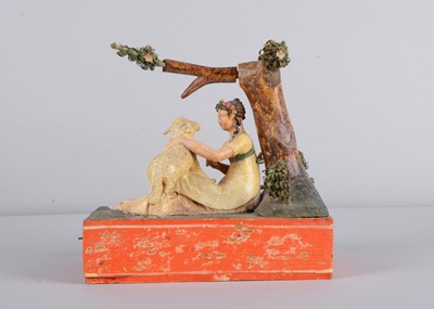 Lot 174 - An 1830s Sonneberg papier-mâché and wood hand-cranked mechanical toy of a shepherdess