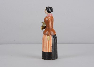 Lot 241 - An early to mid 19th century Oberammergau wooden figure of a woman with suitor hidden in her skirt
