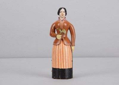 Lot 241 - An early to mid 19th century Oberammergau wooden figure of a woman with suitor hidden in her skirt