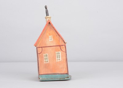 Lot 267 - A 19th century Erzgebirge painted wooden kitchen house crank toy