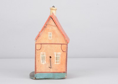 Lot 267 - A 19th century Erzgebirge painted wooden kitchen house crank toy