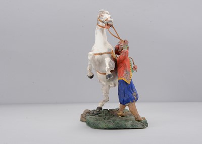 Lot 356 - An exhibition quality mid 19th century Thüringen composition  Turk with rearing horse