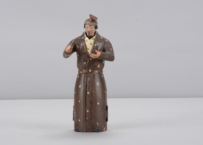 Lot 373 - An early to mid 19th century Oberammergau wooden figure of a shopkeeper with shop hidden in robe