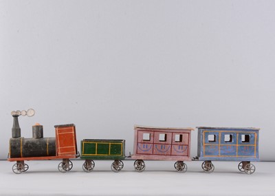 Lot 471 - A late 19th century Erzgebirge wood and cardboard floor train