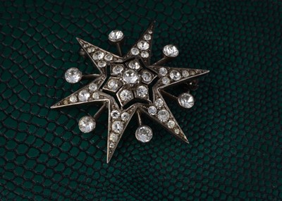 Lot 52 - A late 20th Century paste and silver set six point star brooch